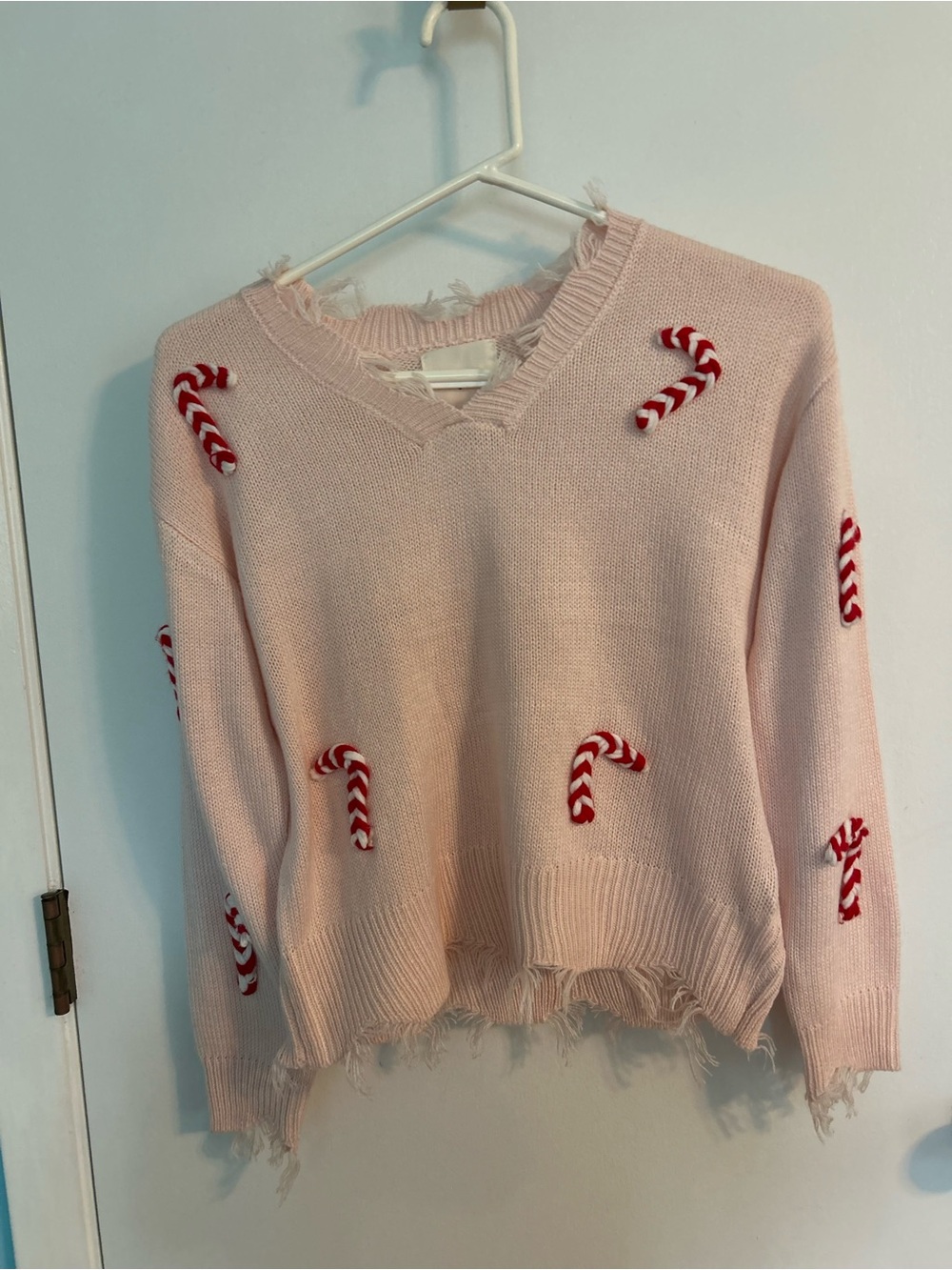 Christmas sweater Distressed Light Pink V-Neck Sweater with Candy Cane Appliqués